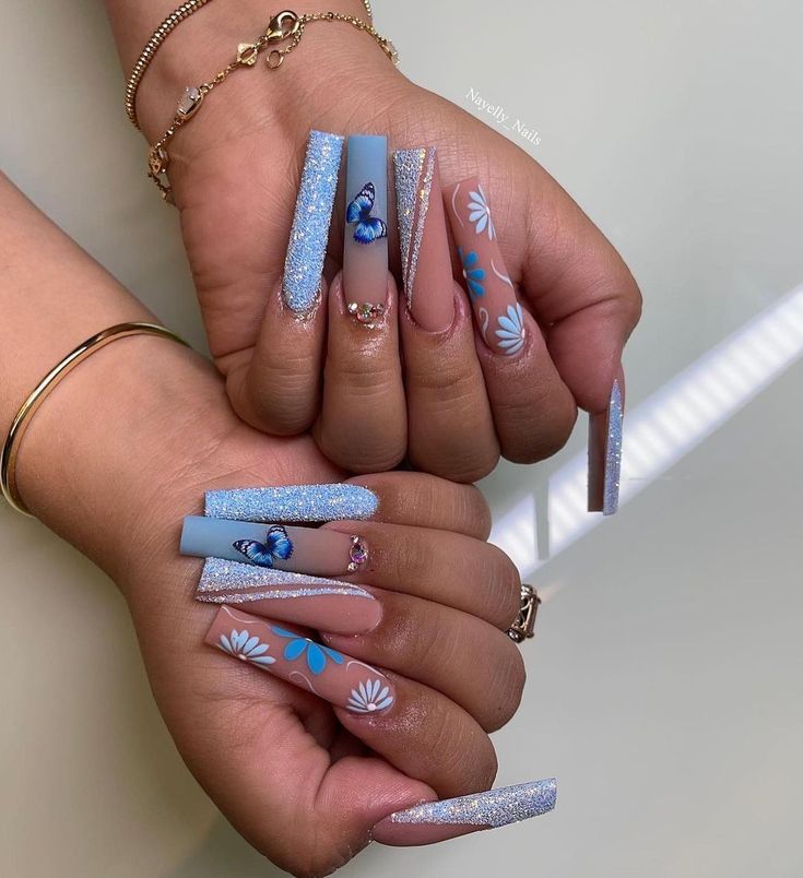 Elegant Soft Blue Nail Design with Silver Accents and Whimsical Butterfly Motifs