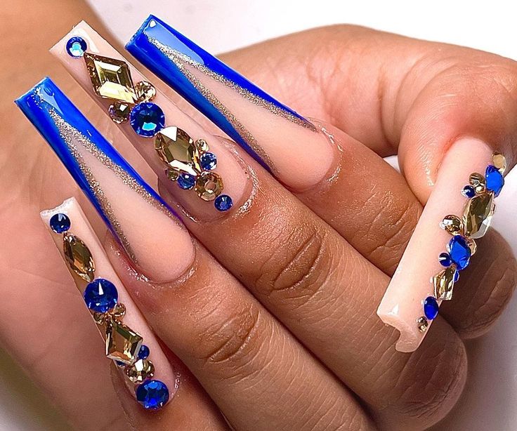 Sophisticated Blue Nail Design with Elongated Shapes and Glamorous Embellishments for Special Occasions