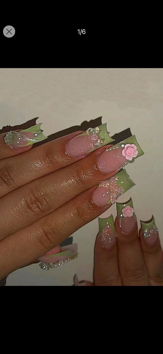 Elegant Floral Nail Design with Soft Pink Base and Intricate Green Tips