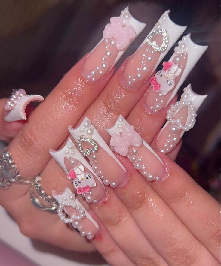 Whimsical Playful Nail Design with Glossy White and Soft Pink Elements.