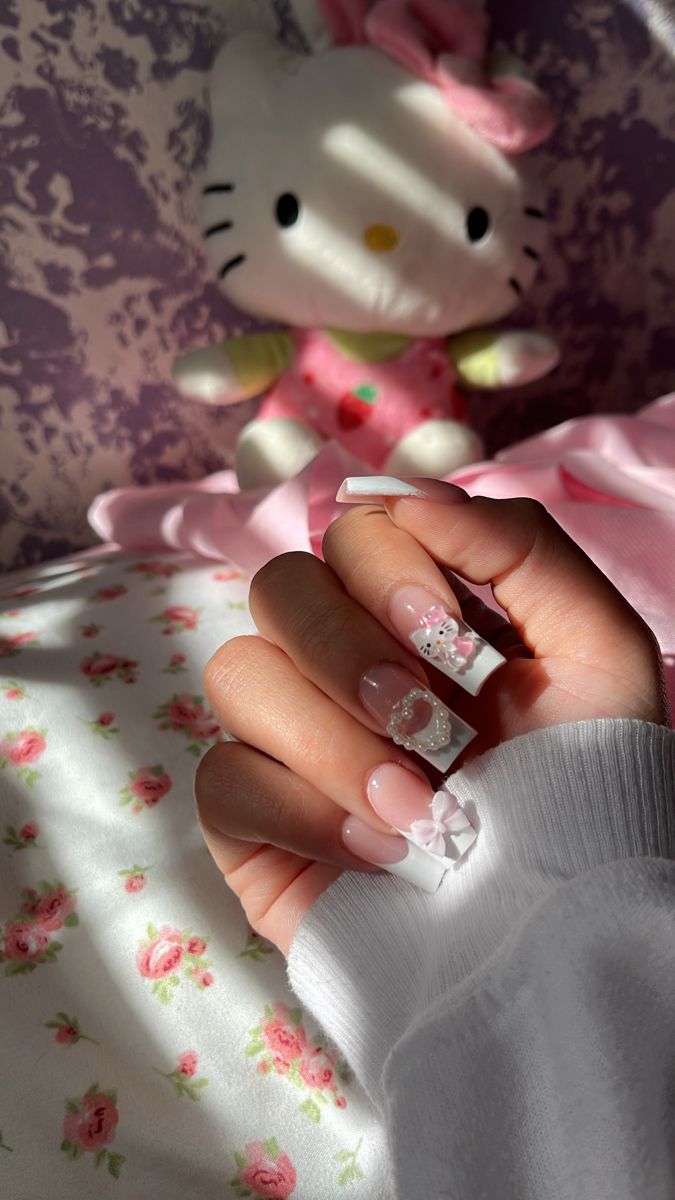 Elegant Floral Nail Design in Soft Pink with Classic White Tips.