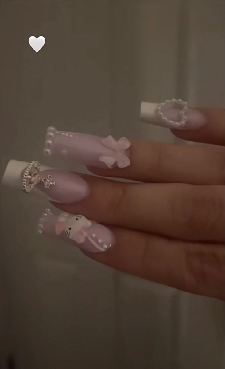 Trendy Cute Pastel Nail Design with Playful Accents and Embellishments.