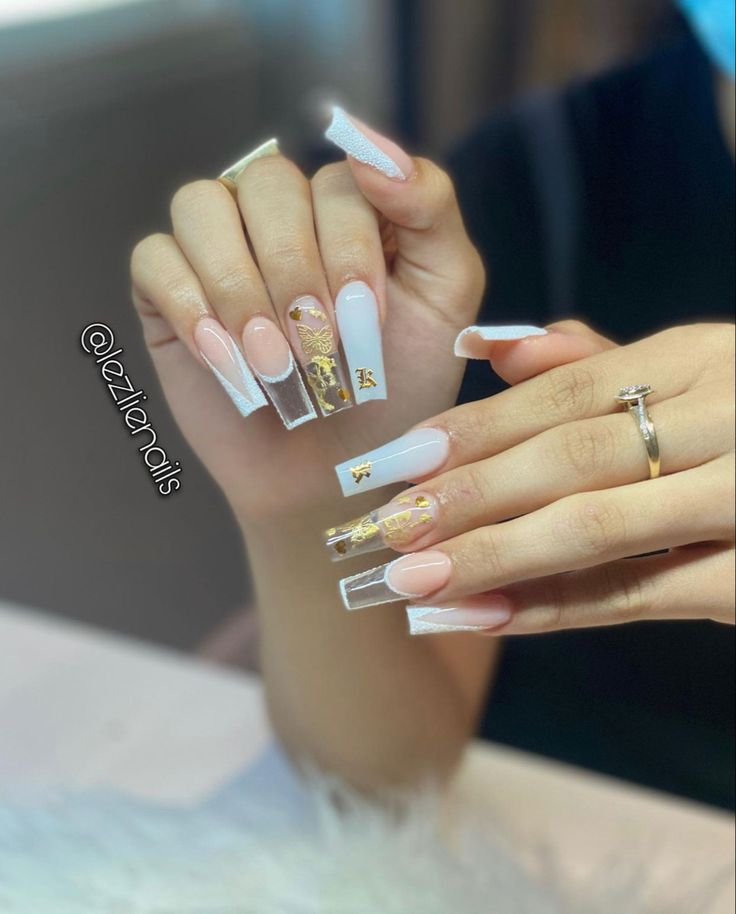 Elegant Pastel Nail Design with Sculpted Shapes and Gold Accents