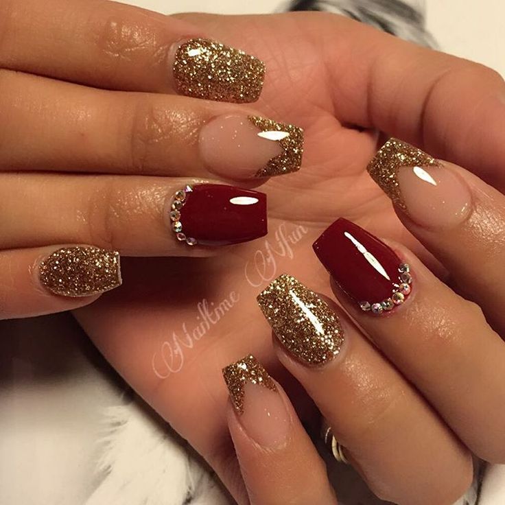 Elegant Red and Glitter Nail Design with Rhinestone Accents.