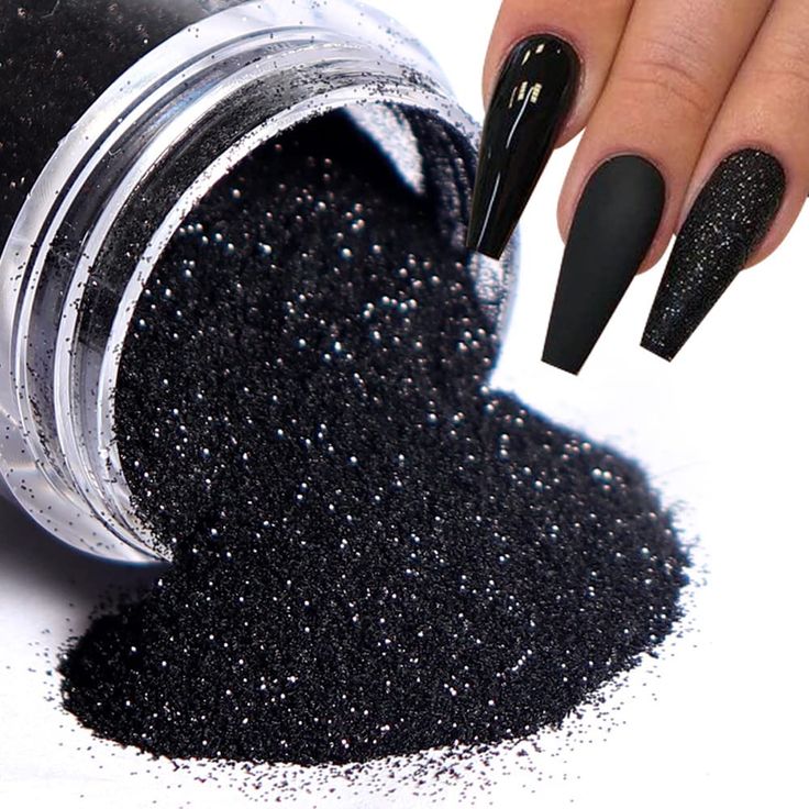 Sophisticated Stiletto Black Nail Design with Matte and Glitter Finishes.