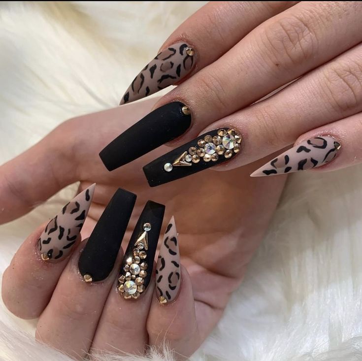 Glamorous Matte Black and Beige Leopard Print Nail Design with Rhinestones.