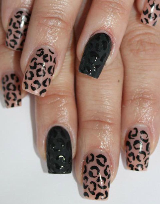 Trendy Bold Leopard Print Nail Design in Nude and Black with Glossy Finish.