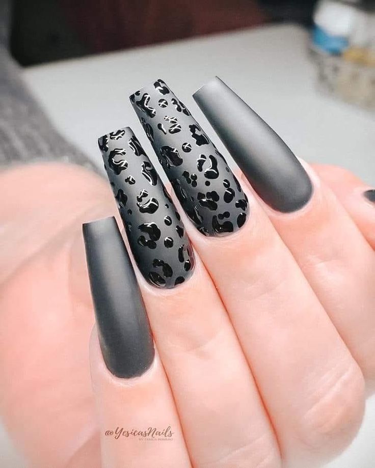 Chic Matte Black Coffin Nails with Bold Leopard Print Accents.