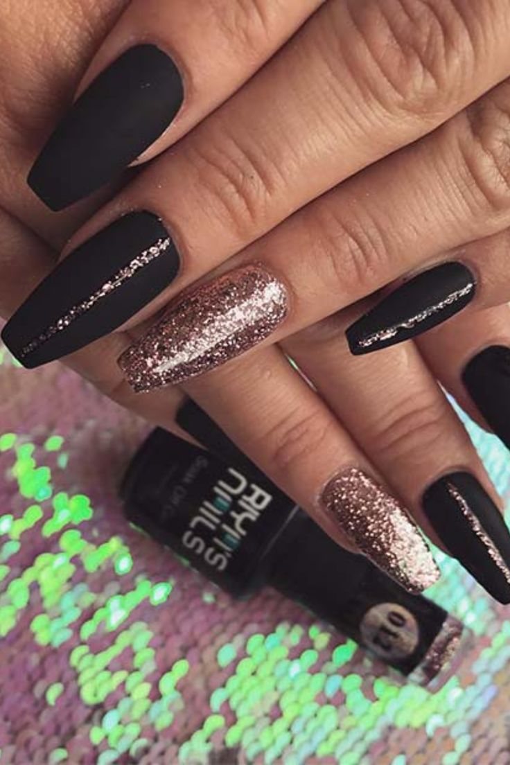 Chic Matte Black and Rose Gold Stiletto Nail Design for a Glamorous Look