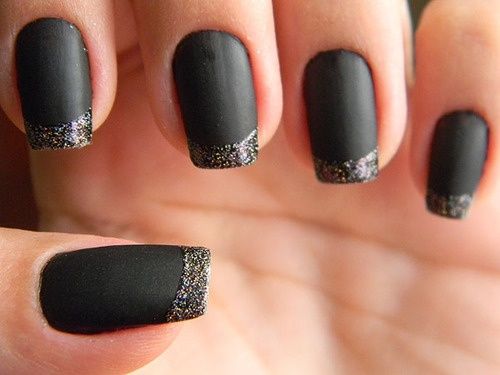 Sophisticated Matte Black Nails with Shimmering Silver Tips for Effortless Glamour.