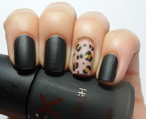 Fierce Sophistication: Matte Black Nail Design with Playful Leopard Print Accents.