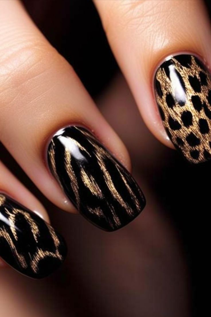 Sleek Black and Gold Nail Design with Edgy Animal Print Flair