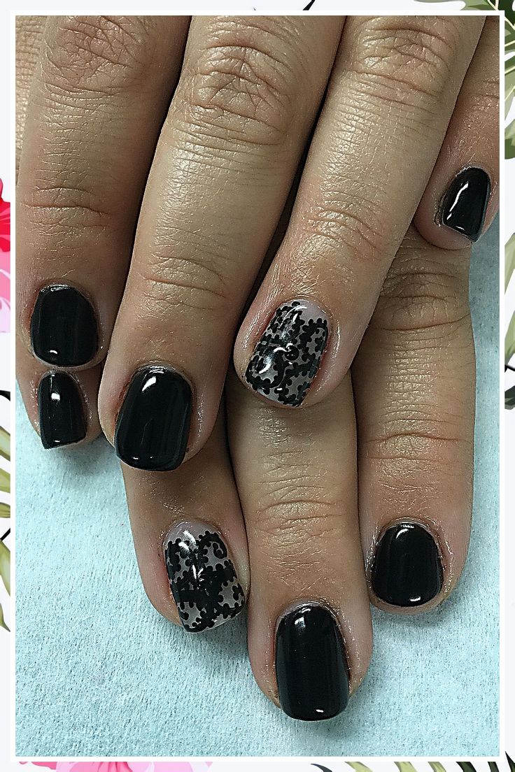 Chic Black Nail Design with Sophisticated Patterns and Glossy Finish