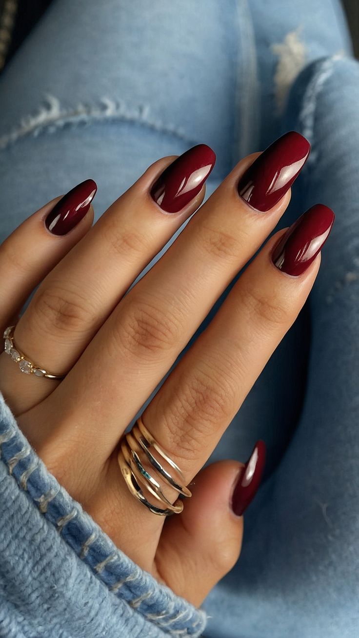 Elegant Elongated Burgundy Nail Design with Glossy Accents for Any Occasion