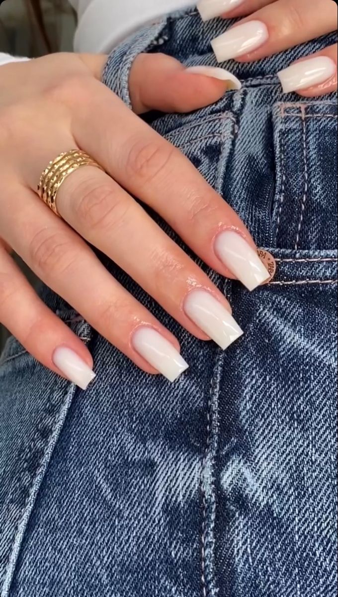 Chic Creamy White Nail Design with Gradient Tips and Gold Accents for Casual Style.