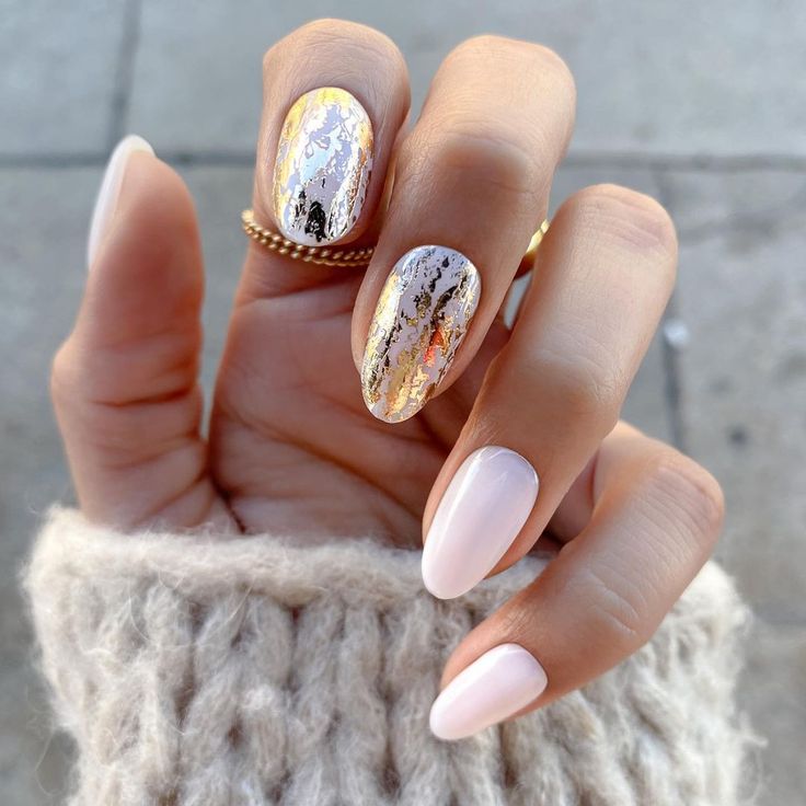 Chic Pastel Pink Nail Design with Striking Metallic Accent Nail