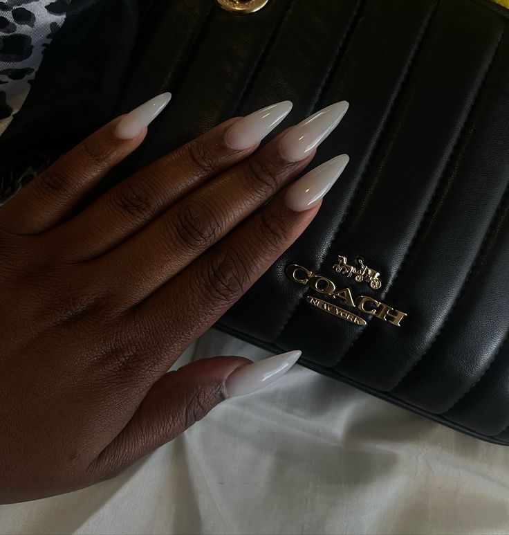 Sophisticated Ombre Almond-Shaped Nails Enhanced by a Chic Black Handbag.