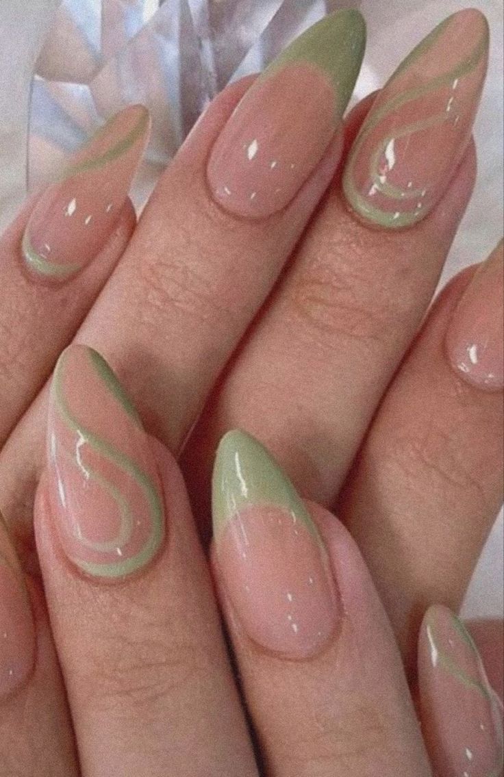 Elegant Soft Pink Nail Design with Green Tips and Flowing Pale Green Swirls.