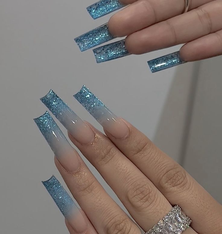 Elegant Blue Ombre Glitter Nails: A Striking Statement for Any Occasion