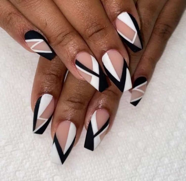 Chic Geometric Nail Design in Black, White, and Nude for Bold Elegance.