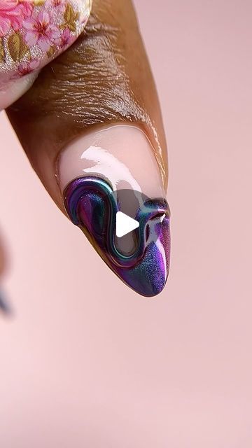 Vibrant Marbled Nail Design: A Modern Elegance in Deep Purples and Shimmering Blues.