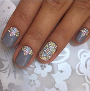 Elegant Mosaic Nail Design with Soft Gray Base and Colorful Pastel Accents.