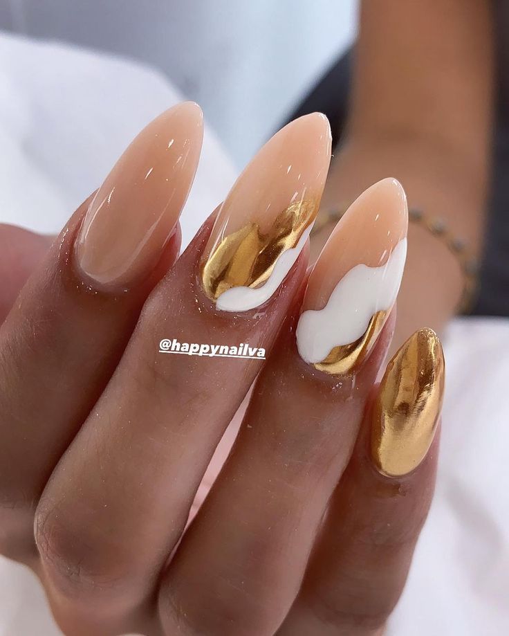 Chic Almond-Shaped Nails: A Sophisticated Blend of Nude, Glossy Gold, and White Accents