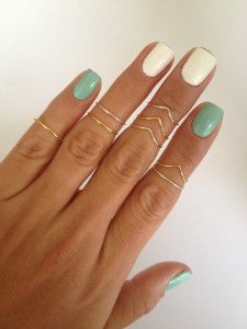 Charming Mint Green and White Nail Design with Elegant Gold Accents.