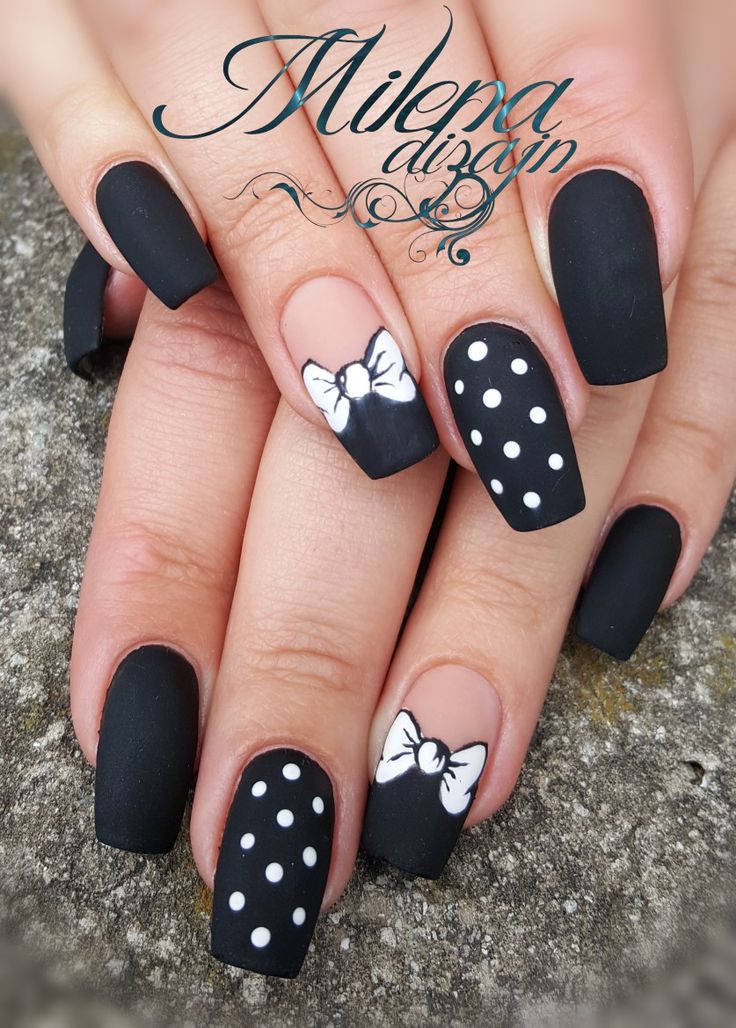 Sophisticated Matte Black Nails with Playful White Polka Dots and Bows