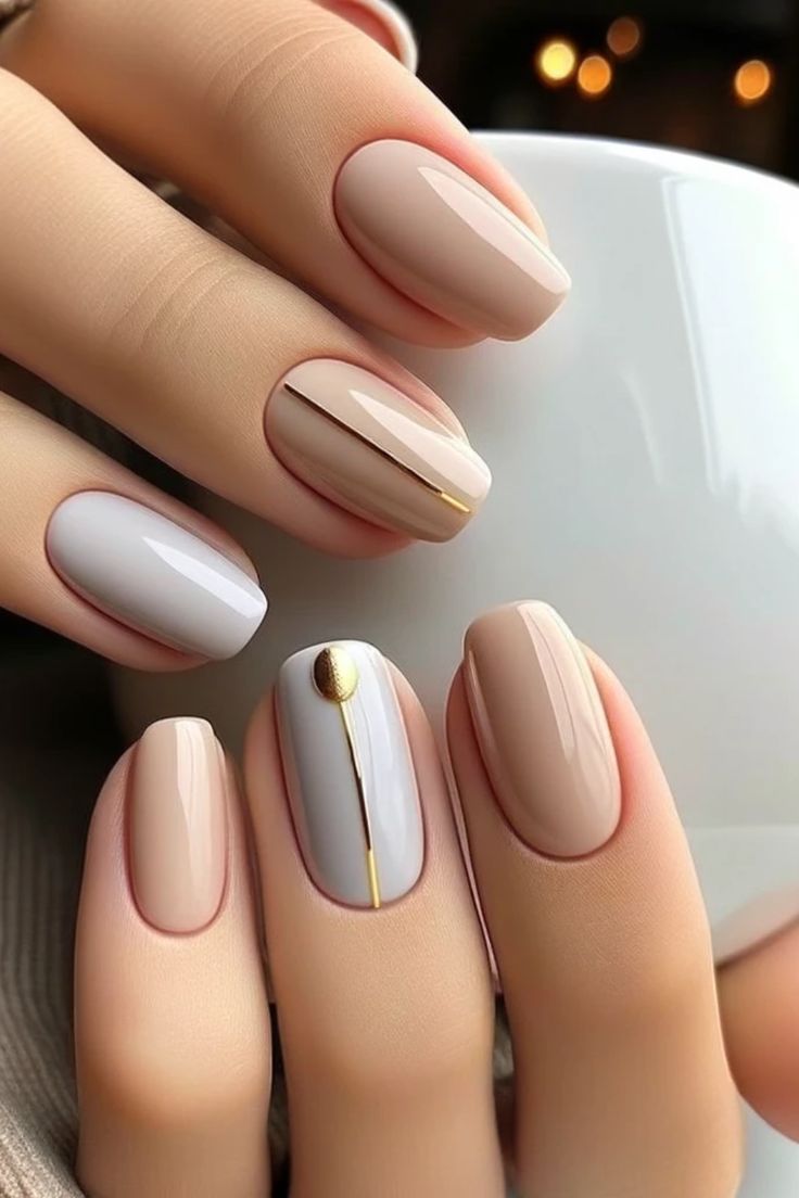 Sophisticated Nude Nail Design with Gold Foil Accents for Any Occasion