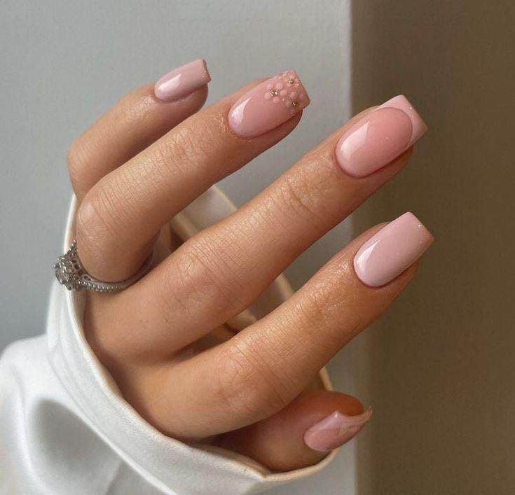 Chic Soft Pink Nail Design with Glossy Finish and Elegant Accent.