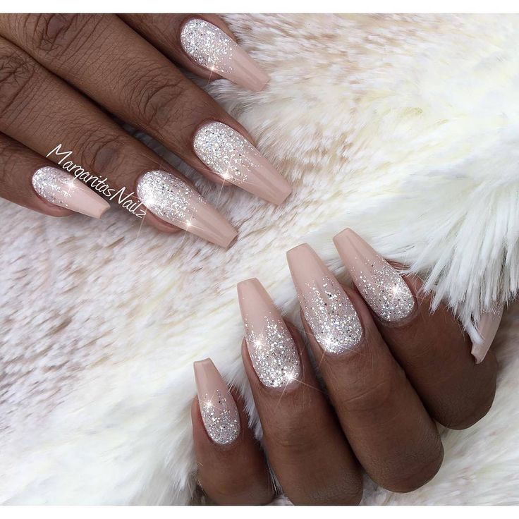 Chic Almond-Shaped Nails: Nude Base with Glitter Gradient for Elegant Style.