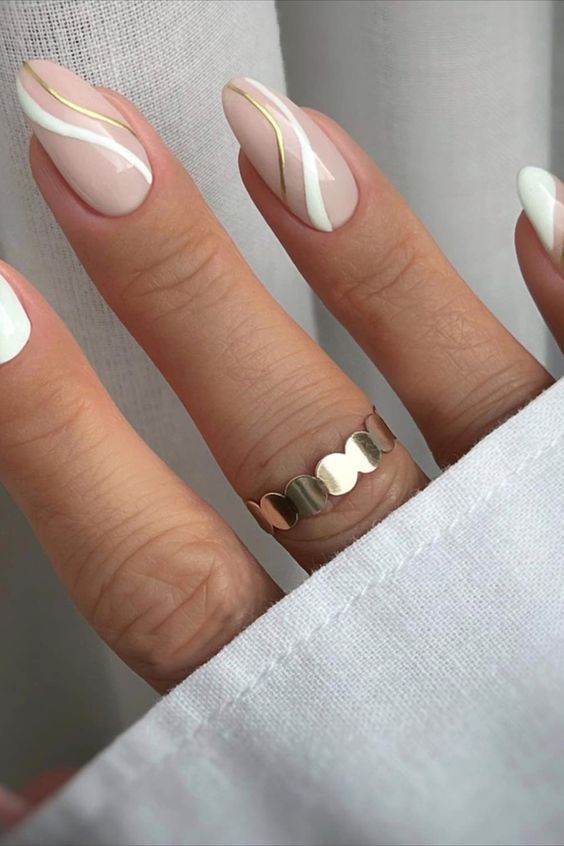 Chic Minimalist Nail Design with Soft Nude Base and Gold Geometric Accents