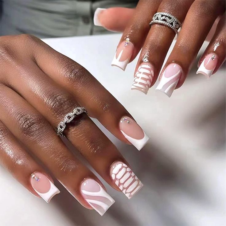 Sophisticated Nail Design Blending Classic French Tips with Modern Artistic Elements.