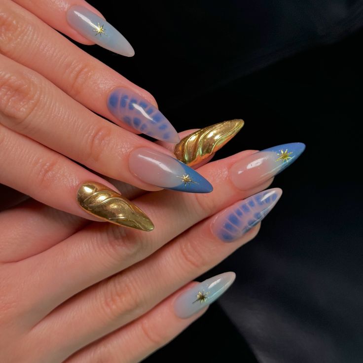 Chic Nail Design: Elegant Shapes, Pastel and Metallic Gradient with Sparkling Star Accents.