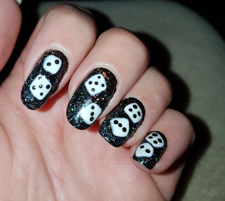 Whimsical Dice Motif Nail Design with Shimmering Black Base