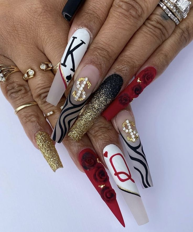 Bold and Intricate Nail Design: A Stunning Fusion of Colors, Finishes, and Unique Accents.