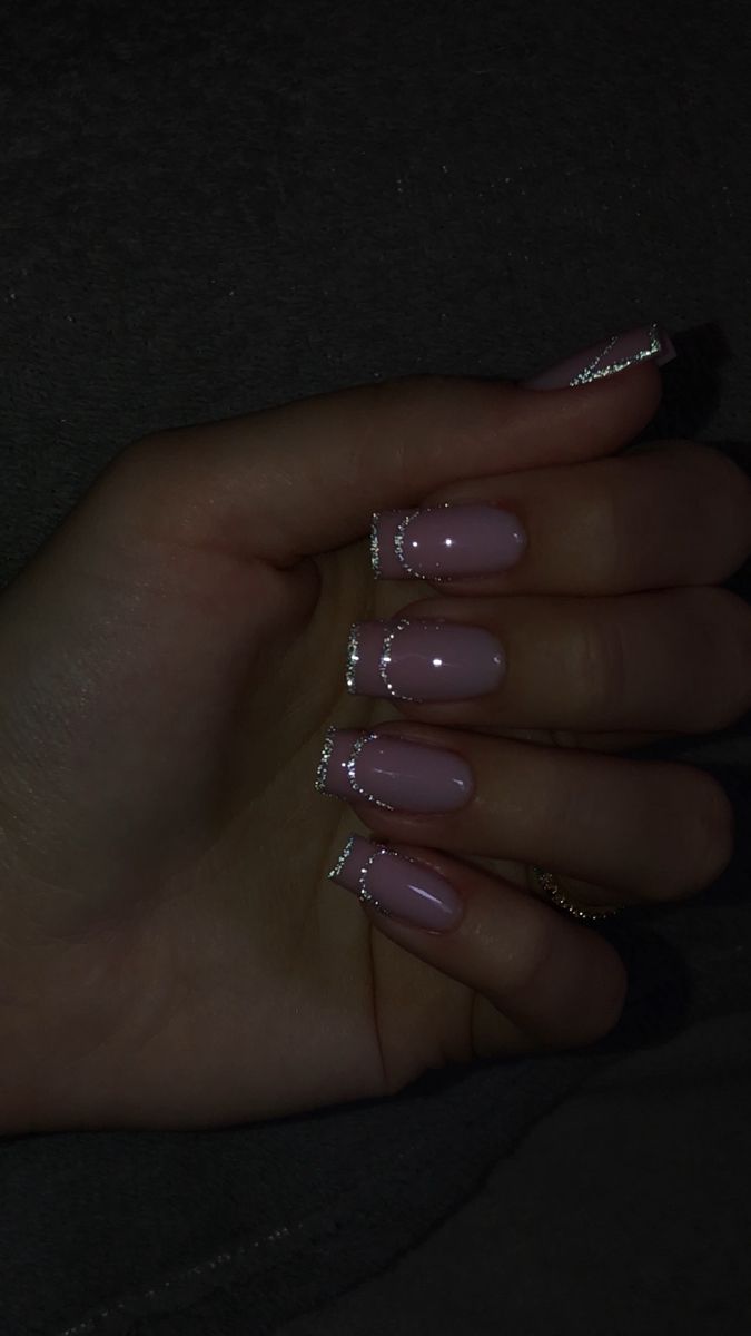 Elegant Soft Pink Nail Design with Glossy Finish and Sparkling Silver Accents.