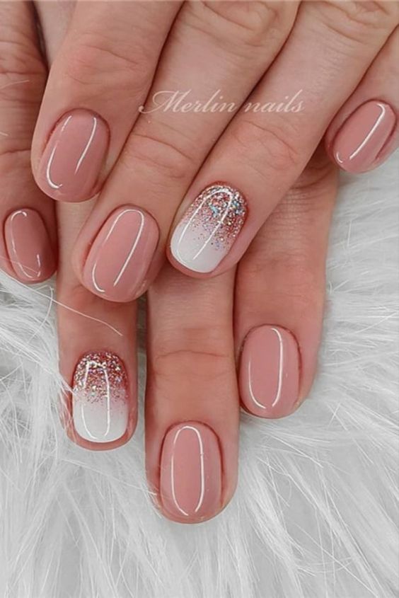 Sophisticated Soft Nude Ombre Nail Design with Glitter Tips