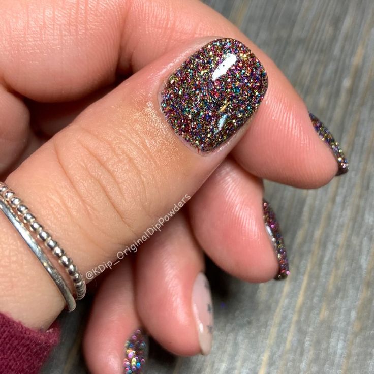 Glistening Rainbow Glitter Nails: Dazzling, Textured Statement for Any Occasion.