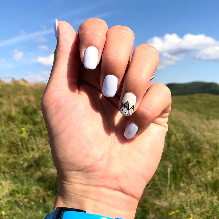 Minimalist White Nail Design Featuring Artistic Mountain Motif