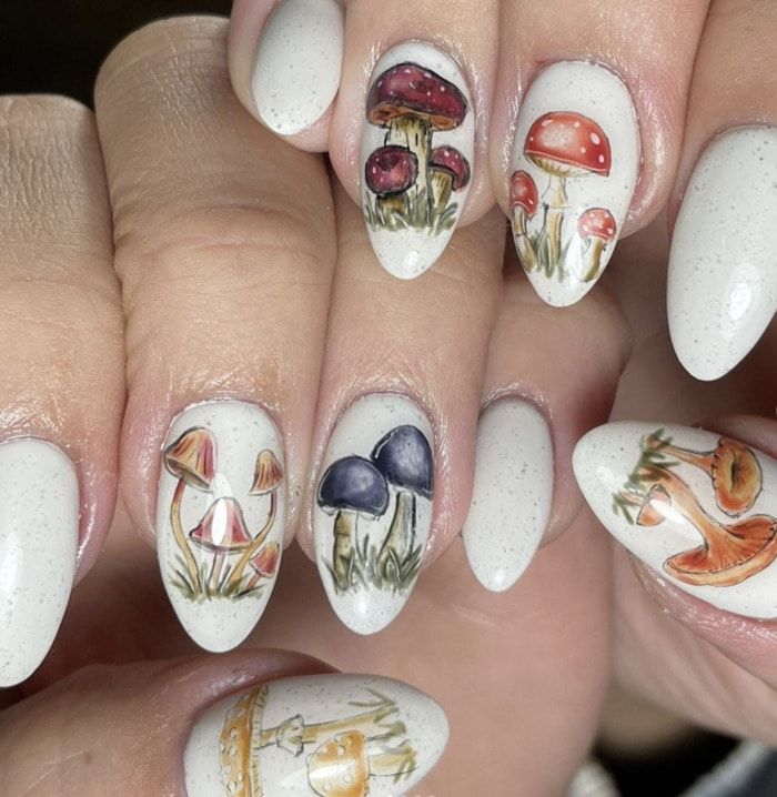 Playful Whimsical Mushroom Nail Art with Intricate Hand-Painted Designs.