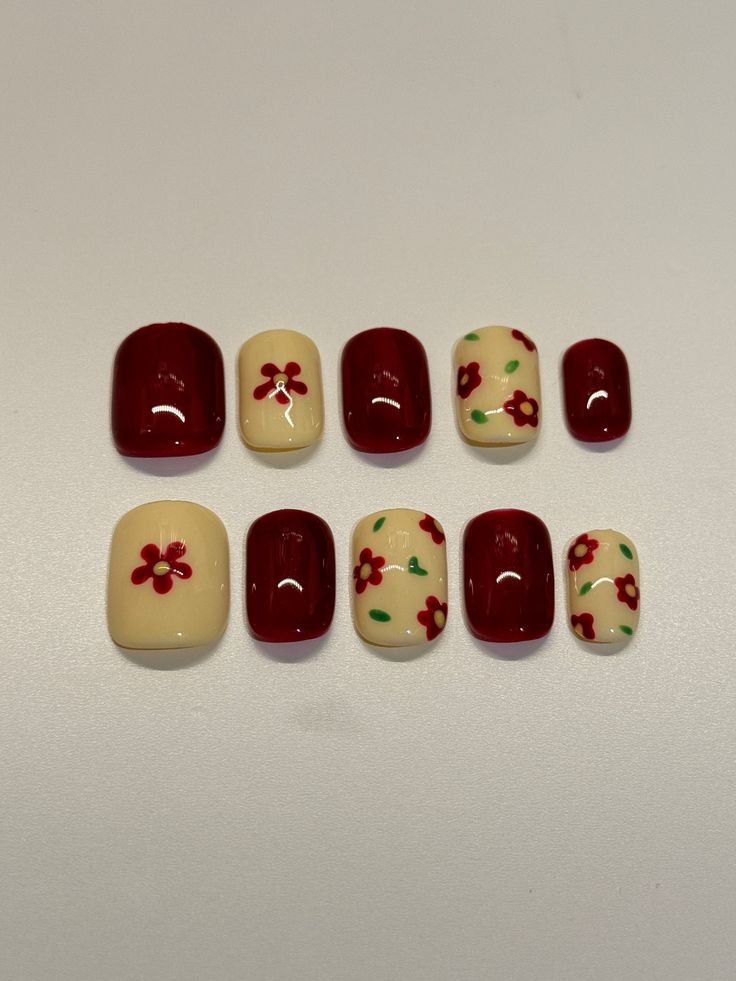 Charming Vintage Floral Nail Design in Deep Red and Soft Cream.