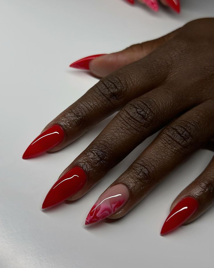 Sophisticated Red Almond-Shaped Nails with Glossy Finish and Swirling Pink Accent.