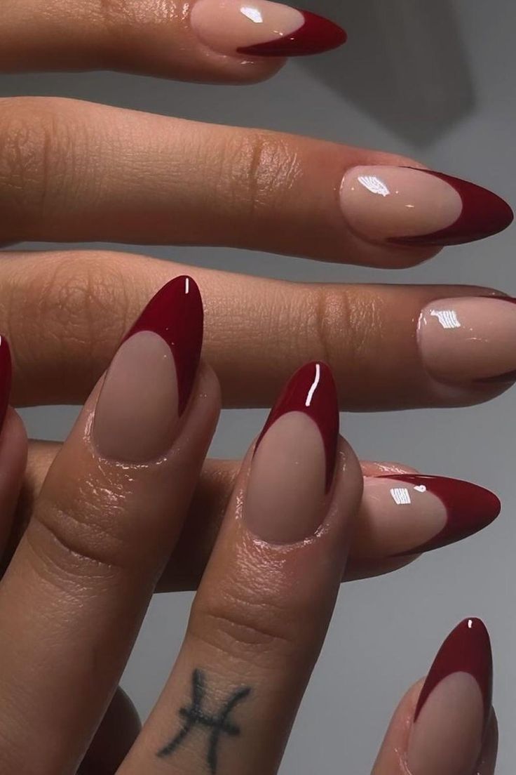 Sophisticated Nude and Deep Red Nail Design for a Chic, Modern Look.