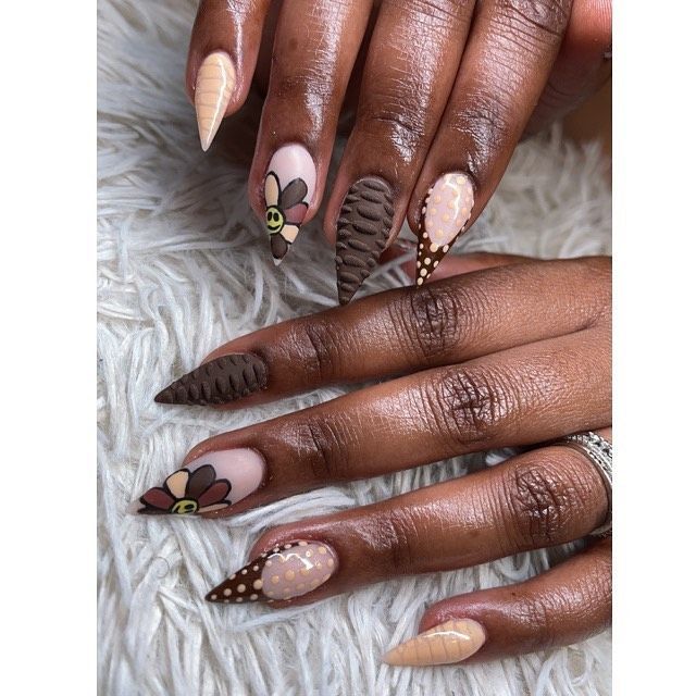 Sophisticated Floral Nail Design with Matte-Gloss Mix and Textured Accents