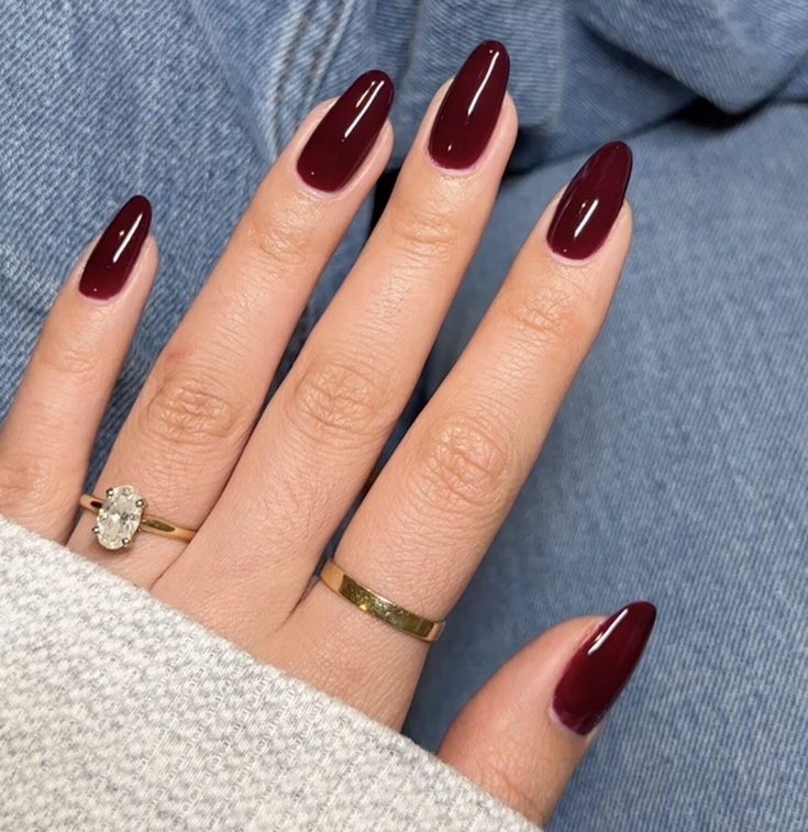 Chic Deep Burgundy Almond-Shaped Nails: A Sophisticated Elegance for Any Occasion.