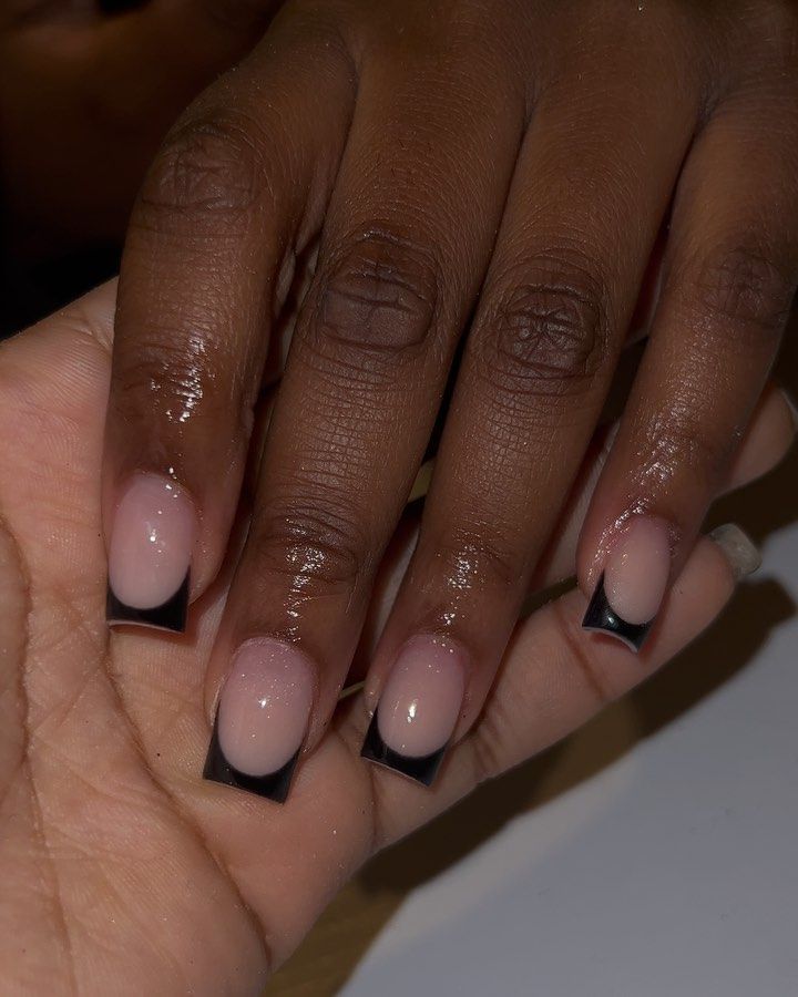 Chic Soft Pink Nails with Bold Black Tips: A Sophisticated Yet Edgy Design.