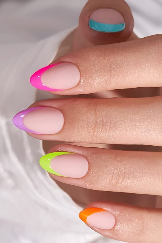 Vibrant Neon Tip Accents on Soft Nude Nails for a Fun, Stylish Look.