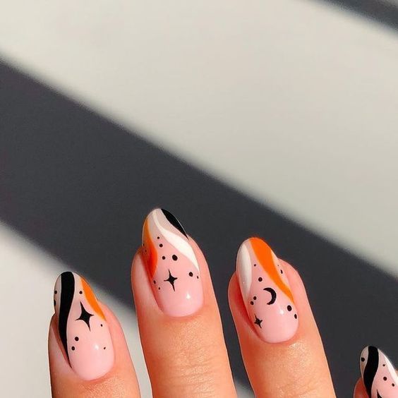 Chic Pastel and Bold Nail Design with Abstract Patterns and Star Motifs for Creative Expression.